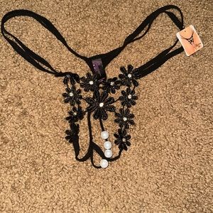 Brand new lacy black panties with stitched flowers